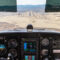 View from cockpit approaching desert runway for landing