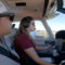 Profile view of Certified Flight Instructor and pilot training in-flight. Image shows both inside Piper Archer aircraft with controls and landscape visible.