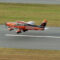 Piper Archer aircraft taking off at small rural airport during flight instruction