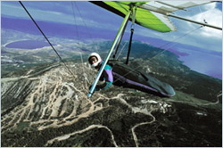 Paul Hamilton soaring on his hang glider at 12,000 MSL after launching from the mountains below at 8200 MSL