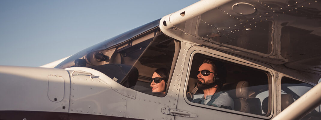 photo of couple in aircraft