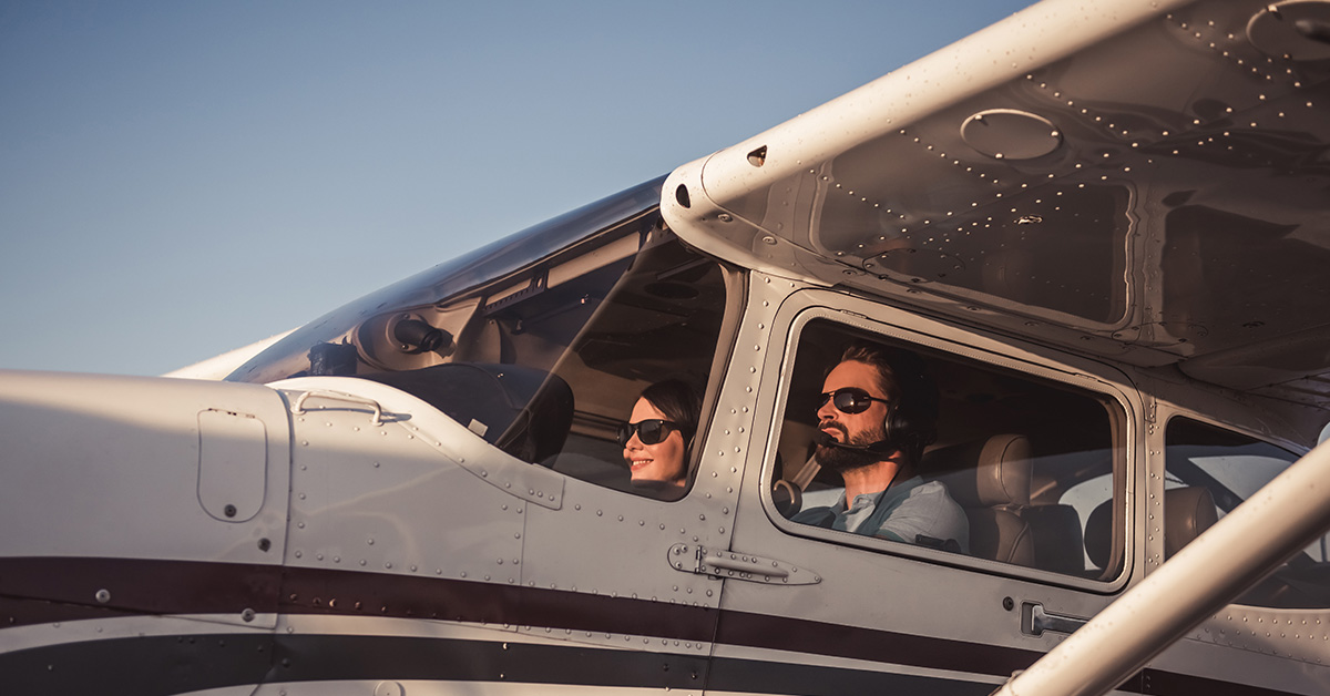 photo of couple in aircraft