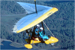 Trike in flight, called weight-shift control (WSC) aircraft by the FAA
