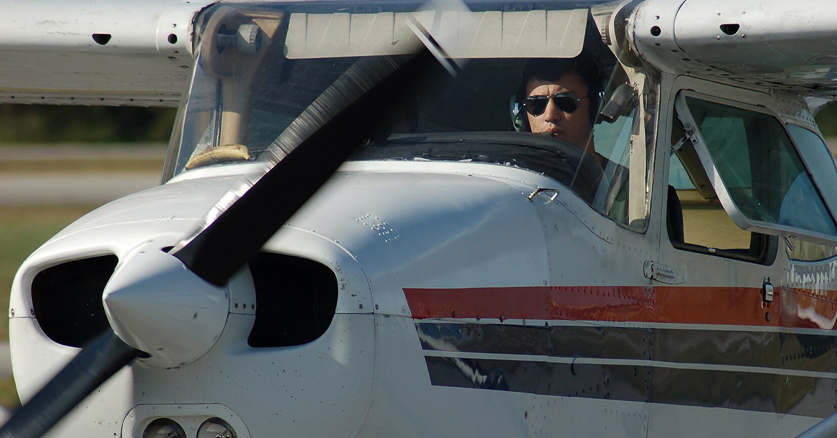 Close up of pilot seen in Cessna 172 Aircraft