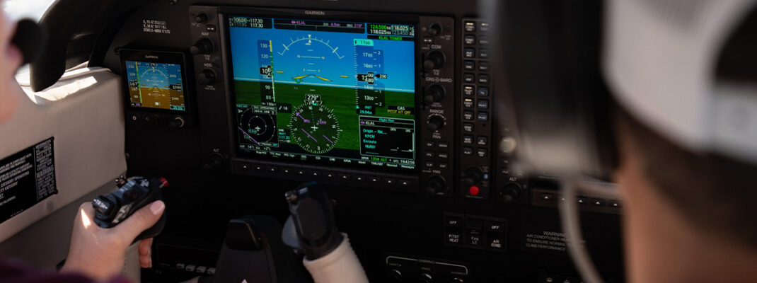 Piper Archer interior with instructor and pilot learning to fly during ground school