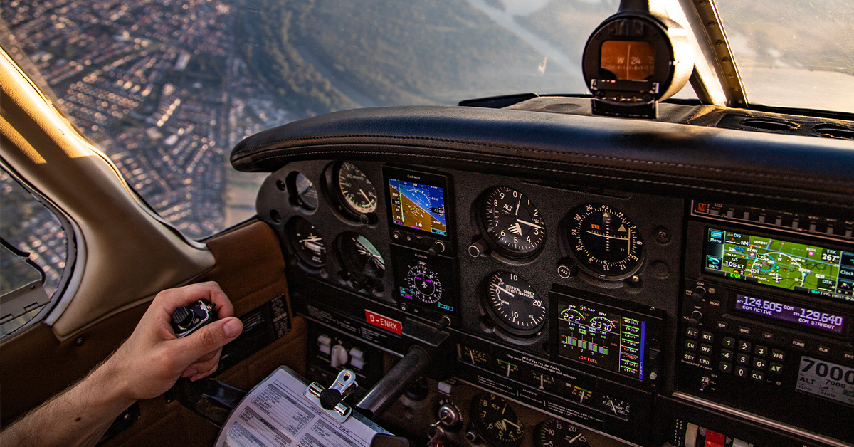 piloting an aircraft from one geographic position to another while monitoring one’s position as the flight progresses