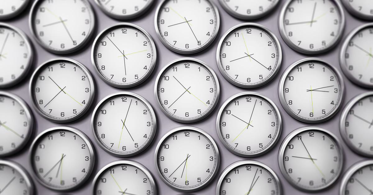 wall of identical clocks set at different times