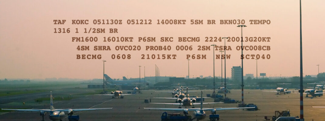 Example TAF atop airport with planes visible on tarmac for preflight maintenance