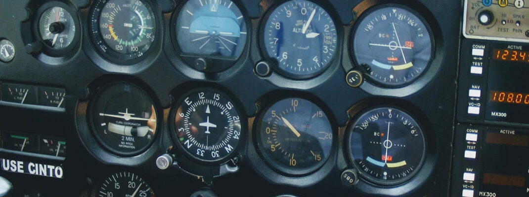 Detailed view of an aircraft cockpit showcasing various control meters and technology.