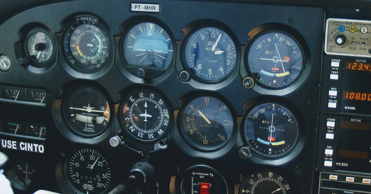 Detailed view of an aircraft cockpit showcasing various control meters and technology.