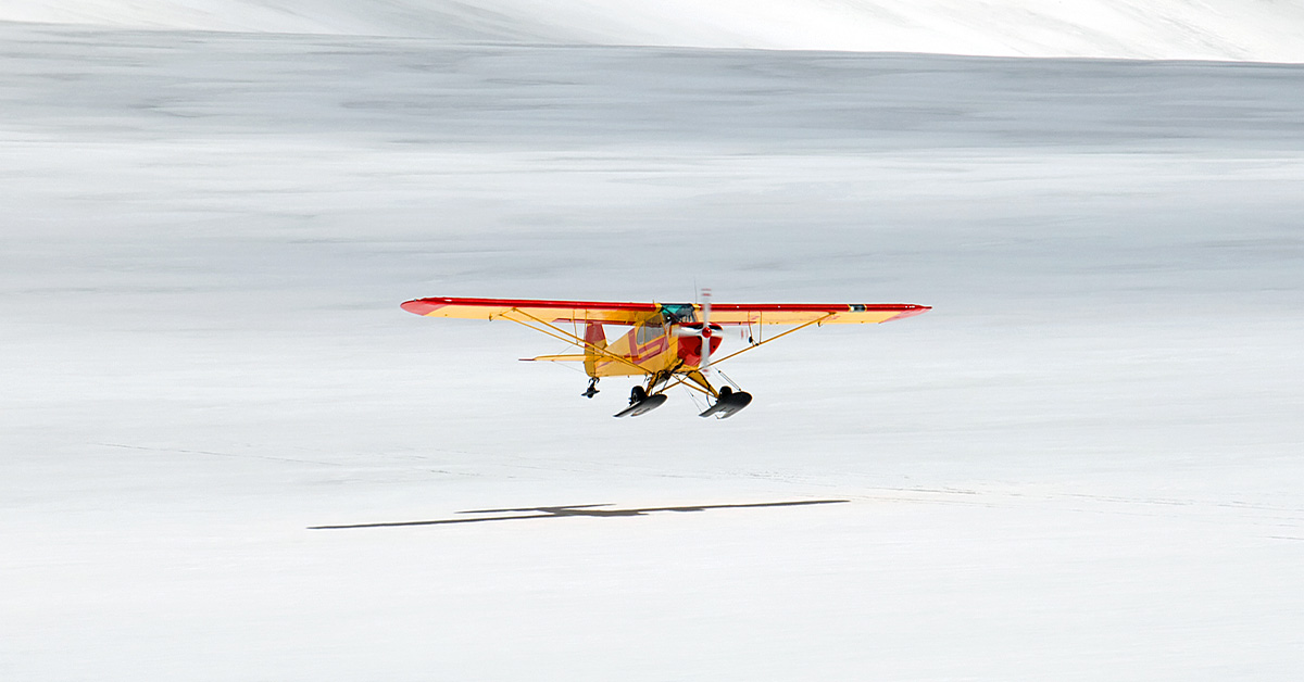 An airplane landing on a glacier