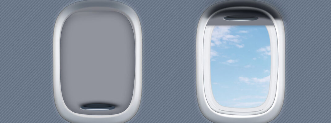 two airplane window one closed and one open