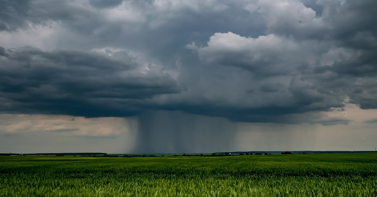 Thunderstorm front in landscape with dark sky with rain clouds before storm.
