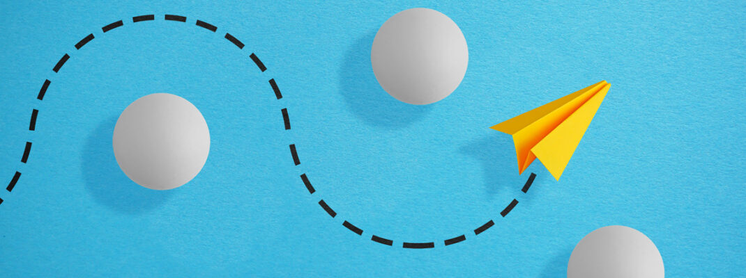 paper airplane navigating around obstacles.