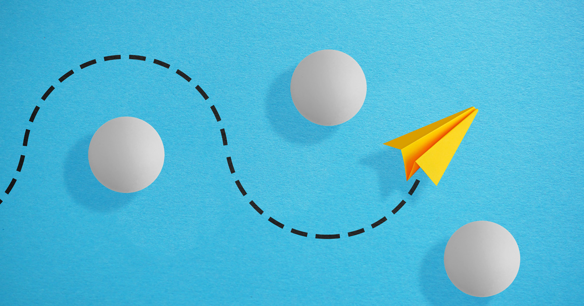 paper airplane navigating around obstacles.