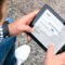 Man holding ipad with ASA's website and FAA test update listings