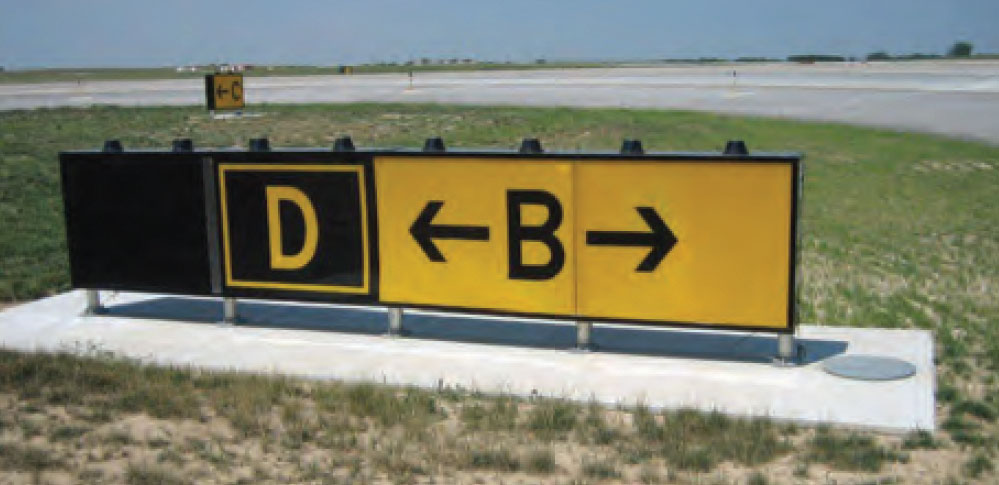 Sign indicating the pilot is on Taxiway D (Delta) and is about to cross Taxiway B (Bravo), from the book Illustrated Guide to Flying by Barry Schiff