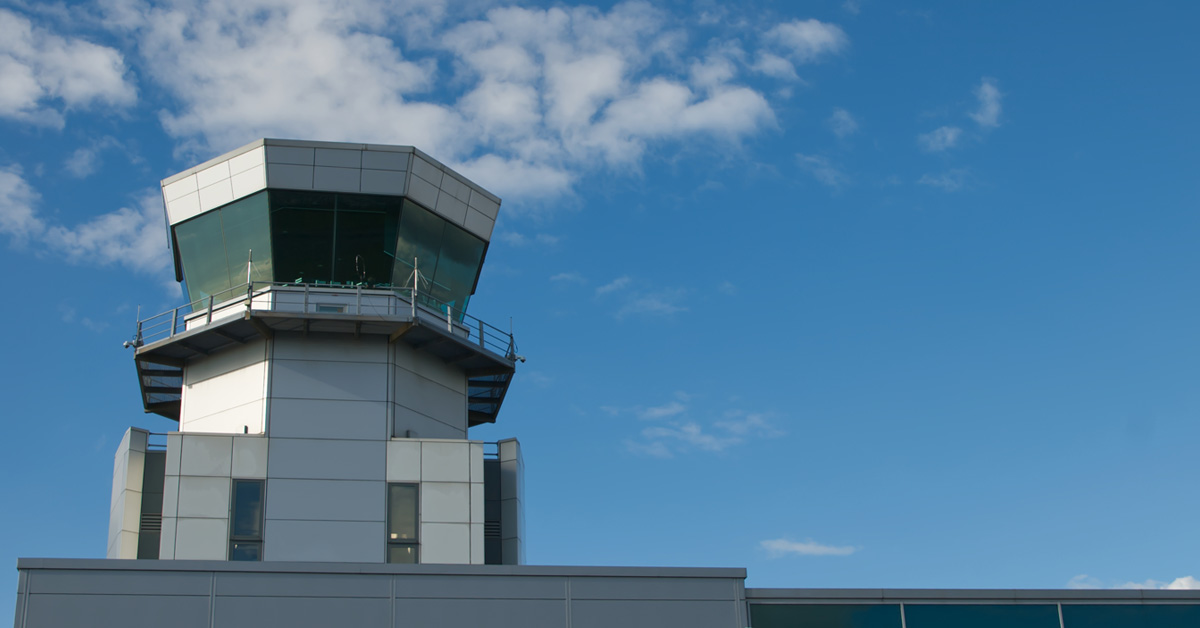airport control tower with sky background