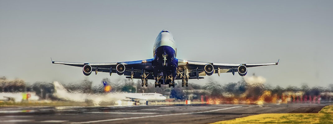 commercial airplane taking off from a runway.