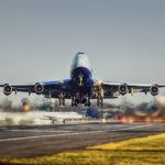 commercial airplane taking off from a runway.