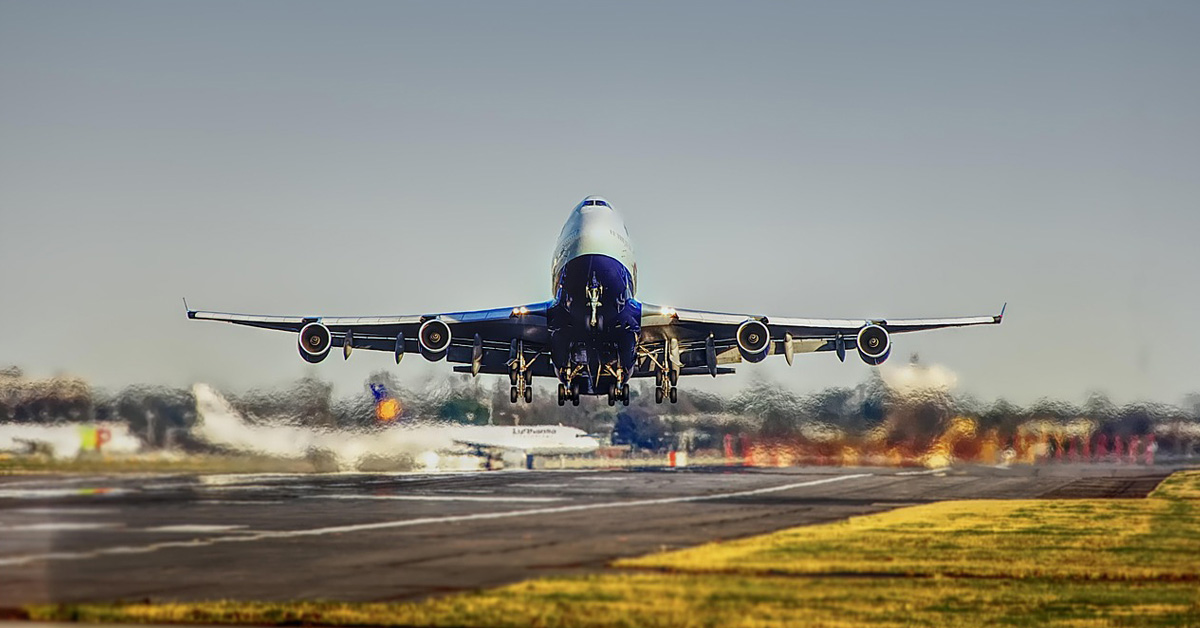 commercial airplane taking off from a runway.