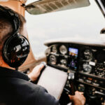 Man in Cockpit Wearing Headphones