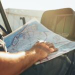 Helicopter pilot studying the flight route map